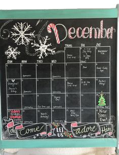 a chalkboard calendar is hanging on the wall in front of a christmas tree and candy canes