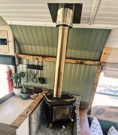 a stove in the corner of a small room