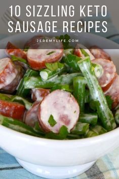 a white bowl filled with green beans, sausages and other vegetables on top of a checkered table cloth