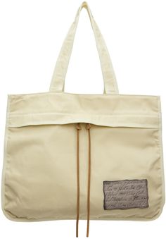 Waxed cotton canvas tote in beige. · Fading throughout · Twin shoulder straps · Zip pocket and logo patch at face · Adjustable cinch strap at sides · Open throat · Zip compartment and patch pockets at interior · Unlined · Logo-engraved metallic pink hardware · H15.5 x W18.5 x D13 Supplier color: Cream beige/beige Beige Canvas Bags With Adjustable Straps, Acne Men, Metallic Pink, Natural Wax, Cream Beige, Waxed Canvas, Waxed Cotton, Canvas Tote, Patch Logo