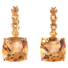 Such a fun dangle style! The round and cushion-cut citrines are a great combination with the 18 karat, yellow gold, pierced mounting! The total stated weight of all of the citrines is 9.10 carats. Yellow Diamond Earring, Yellow Gold Diamond Earrings, Pave Diamond Earrings, Fancy Yellow Diamond, Citrine Earrings, Diamond Collection, Yellow Gemstones, Gold Diamond Necklace, Diamond Earring