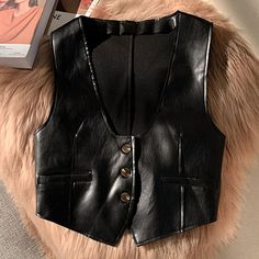 Product Description * Item: Lady Gilet Button Slim Short Coat Vest Pu Faux Leather Sleeveless Top Waistcoat  * Condition: 100% Brand New * Color: Black   Brown  * Size:Asian S-XL * Package:1pc Vest (without any accessories ）    Please note: 1.Please allow a little error due to manual measurement. 2.The color maybe a little difference because of the light,screen reflection etc. 3.If you are not sure what size to choose, you can tell us your height and weight, we will recommend the right size for you. Shipping 1. Your Item(s) will be shipped within 5-15 business days once payment received. 2. Standard shipping to US/UK,you may can get it in 10-20 Business days.   Standard Shipping for Airmail via Post Office 11-30 business Days Come(approximately within 30 days) ship to other country. 3.if y Nashville Vibes, Goth Cowgirl, Leather Vest Outfit, Ladies Gilet, Women Leather Vest, Leather Clothes, Leather Waistcoat, Black Leather Vest, Elegant Pant