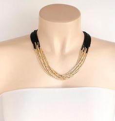 Lovely black and gold necklace. It has 8 strands and available in several sizes at checkout.Please read specifications on SIZES below:❤ SIZESThis item comes in several sizes. Kindly choose at checkout. You can use the diagram on the pictures as a reference, but keep in mind that we all have different neck and body sizes so I recommend you measure yourself to determine the right length for you. Additionally, we carry even more size options in our web www.stephaniemartinco.com and you can take a l Gold Multi-strand Necklace With Black Beads, Elegant Black Double Strand Layered Necklace, Elegant Black Layered Choker Necklace, Black Multi-strand Chain Necklace, Gold Boho Necklace, Black And Gold Necklace, Bridesmaid Necklace Gift, Jewelry Black, Bridesmaid Necklace