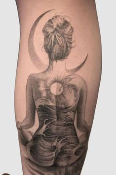 a woman with a tattoo on her leg is sitting in front of the sun and moon