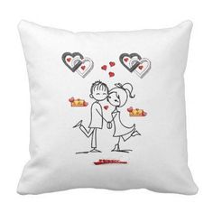 a white pillow with an image of two people kissing and hearts floating above them on it