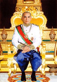 a man sitting on top of a golden throne