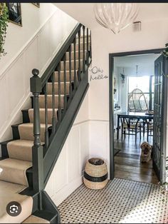 the stairs in this house are painted black and white