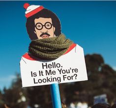 a sign that says hello, is it me you're looking for? with an image of bob ross on it