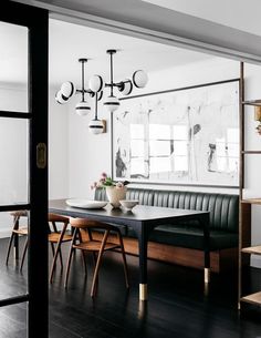 an image of a dining room with black and white decor