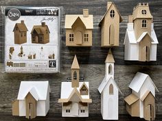 the paper houses are all made up of different shapes and sizes, including one church