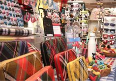 many colorful chairs are on display in a store