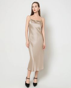 Material: 22 Momme 100% Mulberry Silk;Details: Lightly Draped Cowl Neck, Spaghetti Straps, Bias Cut, Regular Fit;The timeless minimalist silk slip dress is a versatile piece that effortlessly transitions from season to season. With its slim yet relaxed fit, delicate spaghetti straps, and a subtle cowl neckline, this silk midi dress exudes a refined elegance. Whether attending a wedding or a dinner party, it stands as a classic and sophisticated choice, radiating an intense shine that adds to its Fitted Silk Slip Dress In Solid Color, Silk Spaghetti Straps Dress For Daywear, Sleeveless Solid Slip Dress With Bias Cut, Chic Solid Color Bias Cut Slip Dress, Elegant Silk Dress With Spaghetti Straps For Daywear, Solid Silk Midi-length Slip Dress, Camisole Slip Dress For Evening, Solid Color Camisole Slip Dress For Evening, Elegant Formal Solid Color Slip Dress