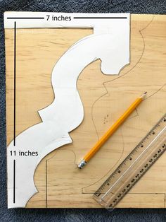 the ruler is next to some cut outs