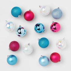 an assortment of colorful christmas ornaments on a white background with space for your own text