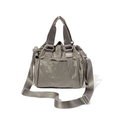 a gray purse with straps on the front and side, sitting against a white background