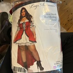 a woman wearing a red riding hood and fishnet stockings in the shape of a lady's costume