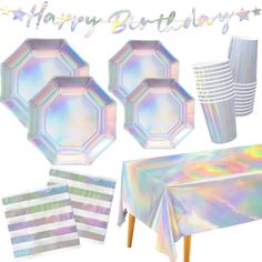 a birthday party set up with holographic plates, napkins and paper cups