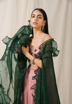 Featuring an onion pink wide palazzos in lightweight silk base.It is paired with an onion pink hand embroidered blouse and a contrast emerald green ruffledembroidered cape in organza base.Care:Dry Clean OnlyComposition:Bamber Silk Onion Pink Saree Contrast Blouse, Silk Embroidery Blouse, Scoop Neckline Blouse, Onion Pink, Hand Embroidered Blouse, Embroidered Cape, Indian Designs, Desi Wear, Palazzo Set