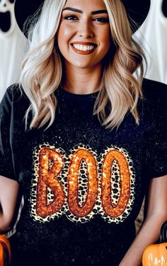 This BOO-tiful bold Halloween tee is a spooky-chic statement piece! The word "BOO" is spelled out in striking orange sequins with leopard-print accents adding a touch of wild style! Unique bleach-splatter design gives it a cool, edgy vibe! A fun and glamorous piece to add to your autumn wardrobe! Super soft unisex tee. True to size. SM 2/4, MED 6/8, LRG 10/12, XL 14/16, 2X 18/20, 3X 22/24 FREE SHIPPING! Curvy Rompers, Grab Bag Gifts, Spooky Chic, Curvy Swim, Boo Tiful, Fall Faves, Sequin Tee, Autumn Wardrobe, Self Tanner