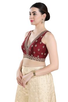 Product Features: Blouse Color: Maroon Blouse Fabric: Mulbury Silk Pattern: Embroidered Sleeves: Half Sleeve Neckline: Round Closure: Front Open Wash: Dry Clean Occasion: Casual,Festival,Bridesmaid Product Type: Blouse Disclaimer: There will be slight difference in digital to actual image Bollywood Style V-neck Top With Resham Embroidery, Bollywood Style Embroidered V-neck Top, Traditional V-neck Blouse With Intricate Embroidery, V-neck Wedding Blouse With Intricate Embroidery, Bollywood V-neck Blouse With Resham Embroidery, Fitted V-neck Blouse With Intricate Embroidery, Festive Floral Embroidered V-neck Top, Traditional V-neck Embroidered Top For Wedding, Traditional Embroidered V-neck Top For Wedding