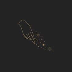 a hand reaching for some stars on a black background with gold lines and sparkles