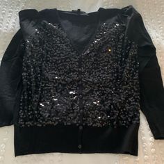 Black Sequin Sheer Front Black Cardigan Button Up Sweater Size S/M Never Worn Chic Black Button-up Sweater, Black Button-up Cardigan, Black Button-up Cardigan With Button Closure, Black Buttoned Spring Sweater, Black Button-up Sweater With Buttons, Black Buttoned Sweater For Spring, Black Fitted Button Sweater, Winter Tops With Buttons For Night Out, Elegant Black Cardigan With Button Closure