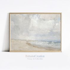 a painting hanging on the wall next to a white wall with an ocean scene in it