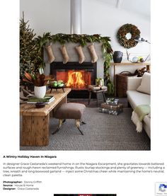 a living room decorated for christmas with stockings and stockings hanging over the fire place in front of the fireplace