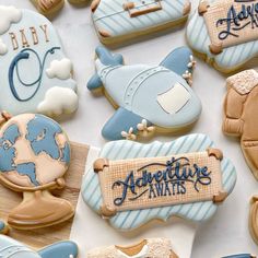 baby shower cookies decorated like airplanes and planes