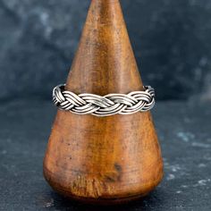 This light but durable ring is hand-braided with nine strands of sterling silver wire in three braids to create a traditional braided knot ring. It has an oxidised finish to highlight the braided detail.  This design is suited for men and women and comes in sizes 5 - 12 US. Would make a great promise ring for you and your partner, especially with Celtic, Scottish or Irish heritage.  * Select ring size when ordering - check our if unsure * Weight: 3g, Width: 4mm * Comes Gift boxed * Ships direct from Edinburgh, Scotland * Supports a small artisan business Three Braids, Viking Designs, Gold Vermeil Jewelry, Celtic Rings, Knot Ring, Edinburgh Scotland, Vermeil Jewelry, Men's Jewelry Rings, Lovely Ring