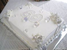 a large white cake sitting on top of a table