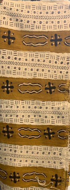 These mud cloth pieces, which are made in Mali where the owners of the shop are from, are approximately 38" - 45" wide x 63" - 68" long. Sizes may vary as these are hand made. Traditional African mud cloth sheets are handwoven and made one at a time. Cloth Pieces, Cowrie Shells, African Mud Cloth, Cowrie Shell, Gold Stripes, Hand Woven, Hand Weaving, Shells