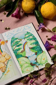 an open children's book on a table with flowers and lemons