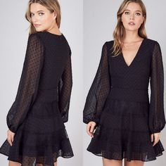 This Dotted Swiss Dress Embodies Elegance With It's V-Neck And Feminine Lace Details. Completed With The Billowy Sleeves And Elastic Wrists. There Is No Doubt That This Little Black Dress Is Stunning. Complete Your Looks With Heels And Dainty Jewelry. Lined. Hidden Zipper Closure. Small (0-2) 35'' Length From Shoulder. Medium (4) 36'' Length From Shoulder. Large (6-8) 36'' Length From Shoulder. Polyester. Elegant V-neck Swiss Dot Dress, Elegant Swiss Dot V-neck Dress, Polka Dot V-neck Mini Dress For Night Out, Polka Dot Swiss Dot V-neck Dress, Black Fitted Swiss Dot Dress, Fitted Black Swiss Dot Dress, Spring V-neck Mini Dress With Swiss Dot, Elegant Black Swiss Dot Dress, Purple Sparkly Dress