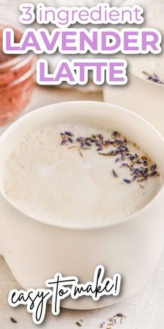 a white bowl filled with lavender latte on top of a table