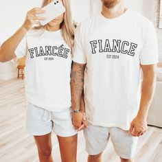 Are you looking for a ENGAGEMENT T SHIRT? We got you! ✅ ABOUT OUR FIANCEE Comfort Colors Tee  ▸ 100% ring-spun US cotton for long-lasting comfort.  ▸  The garment is sewn around the finished edges with double stitching, making it long-lasting ▸  The garment is dyed after it's been constructed, giving it a soft color and texture ▸ Printed and shipped from the USA ✅ HOW TO ORDER   1. Check our photos for sizing and color options. 📏 2. Choose your quantity. Feel free to add as many shirts as you wish! ✨ 3. Select your size and color from the drop-down menus. ✨ 4. Click "ADD TO CART" to add the shirt to your virtual cart. 🛒 5. Click "PROCEED TO CHECKOUT" to purchase your shirt. 🛒 6. Your shirt is now off to production! We will process your order and your shirt will be ready for shipment in Fiancee Shirt, Engagement Shirt, Custom Engagement Gifts, Couple Engagement Pictures, Engaged Shirts, Photo Care, Custom Matches, Announcement Ideas, Comfort Colors Tee