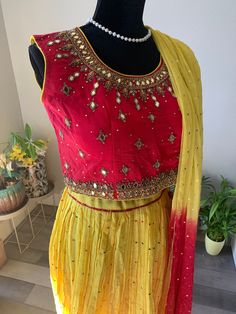 Beautiful crushed silk lehenga set with grand, mirror work blouse and foil print georgette dupatta. The lehenga has polka dots work and is lemon yellow shade. The lehenga top has heavy zardosi work as well as mirror work. Dupatta has gold foil print and comes with latkans at the ends.  Sleeves can be attached on request for a minimal price. Size of blouse : Bust size 38-39 inches (Size M) Size M - Crushed Silk Lehenga Set with Mirror Work Blouse | mirror work lehengas online shopping usa | cropp Blouse Mirror Work, Top Lehenga, Lehenga Top, Crop Top Lehenga, Mirror Work Blouse, Zardosi Work, Georgette Dupatta, Gold Foil Print, Silk Lehenga