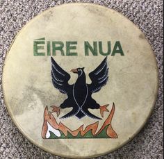 an old drum with the name fire nua written in green and black on it