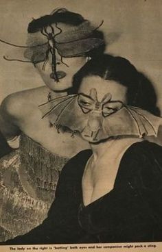 an old photo of two women with masks on their faces