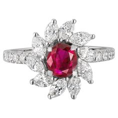 18K WHITE GOLD 10 ROUND DIAMOND, 0.16 CARATS 10 MARQUIS DIAMONDS, 0.81 CARATS 1 NO-HEAT PIGEON BLOOD BURMESE RUBY, 0.77 CARATS SSEF LAB CERTIFIED, PIGEON BLOOD RED Introducing our exquisite Sunflower Ring, a masterpiece of fine jewelry. At its center lies a captivating Burma No-Heat Pigeon Blood Ruby, weighing 0.77 carats, radiating with intense beauty. Surrounding the ruby are ten marquise diamonds, totaling 0.81 carats, gracefully accentuating its brilliance. Additionally, ten round diamonds w Blooming Sunflower, Blood Ruby, Burmese Ruby, Ruby And Diamond Ring, Sunflower Ring, Ruby Diamond Rings, No Heat, Marquise Diamond, Ruby Diamond