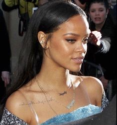 a close up of a person wearing a blue dress