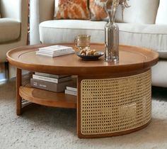 a living room with a white couch and coffee table in it's center area