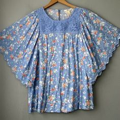 Matilda Jane Blue With Multi-Color Floral Rayon Popover Flutter Sleeve Peasant Top New With Tags! *Labeled Size Large. Please Pay Attention To Measurements As Sizes And Brands Vary. Bust - Measures 21 3/4" Across The Front From Armpit To Armpit Length - 25" Measured From Top Of Shoulder *Comes From A Smoke And Pet Free Home! Cottagecore Flowers Feminine Romcom Bohemian Butterfly Sleeve Spring Blouse, Bohemian Tops With Floral Print And Butterfly Sleeves, Bohemian Floral Print Tops With Butterfly Sleeves, Spring Bohemian Blouse With Butterfly Sleeves, Bohemian Butterfly Sleeve Beach Tops, Bohemian Blouse With Flutter Sleeves For Brunch, Bohemian Tops With Butterfly Sleeves For Beach, Vacation Blouse With Butterfly Sleeves And Floral Print, Butterfly Sleeve Blouse With Floral Print For Vacation