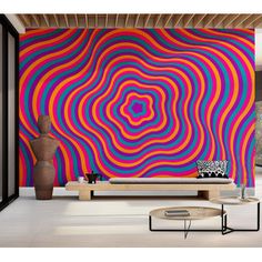 a living room with a large colorful wall mural