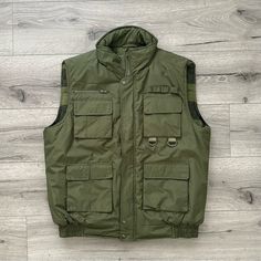 Outdoor Casual Vest (Brand New) For Outdoors Warm Cozy Vest. Great Quality. Winter Military Work Vest, Military Style Winter Workwear Vest, Green Utility Outerwear For Outdoor, Winter Utility Vest In Khaki, Green Utility Vest For Outdoor, Green Outerwear With Multiple Pockets For Outdoor Activities, Green Outdoor Outerwear With Multiple Pockets, Cozy Vest, Casual Vest