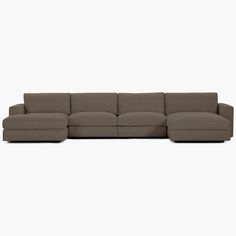 a large sectional couch sitting on top of a white floor