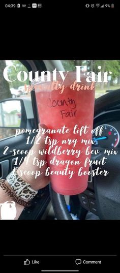 a red cup sitting on top of a car dashboard next to a handwritten message