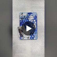 the video is being displayed in front of an open book with blue and white designs on it