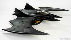 two models of fighter jets sitting on top of each other in the shape of a bat