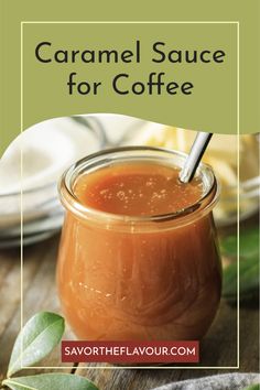 a jar filled with caramel sauce on top of a wooden table